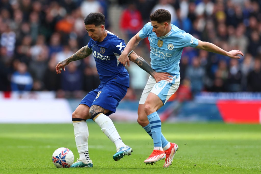Enzo Fernandez of Chelsea competes with Julian Alvarez of Manchester City during the Emirates FA Cup Semi Final match between Manchester City and C...