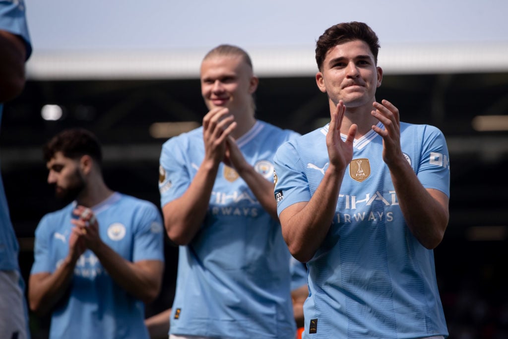 Erling Haaland and Julian Alvarez of Manchester City are applauding their fans after the Premier League match between Fulham and Manchester City at...