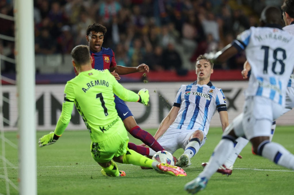 TOPSHOT - Barcelona's Spanish forward #27 Lamine Yamal vies with Real Sociedad's Spanish defender #20 Jon Pacheco as he challenges Real Sociedad's ...