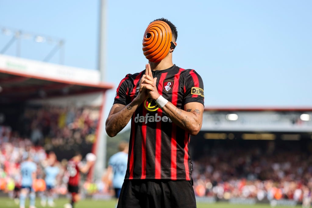 Dominic Solanke of Bournemouth wears a Japanese Anime mask in celebration after he scores a goal to make it 1-1 during the Premier League match bet...