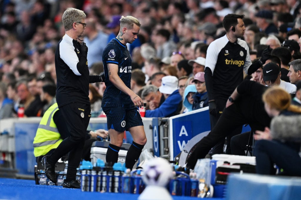 Chelsea's Mykhaylo Mudryk looks dejected after being substituted after suffering an injury during the Premier League match between Brighton and...