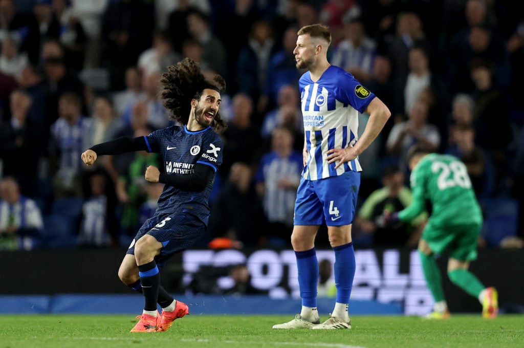 Marc Cucurella of Chelsea celebrates victory as Adam Webster of Brighton & Hove Albion looks dejected following the Premier League match betwee...