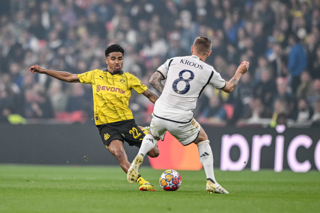 Ian Maatsen of Borussia Dortmund and Toni Kroos of Real Madrid CF battle for the ball during the UEFA Champions League 2023/24 final match between ...