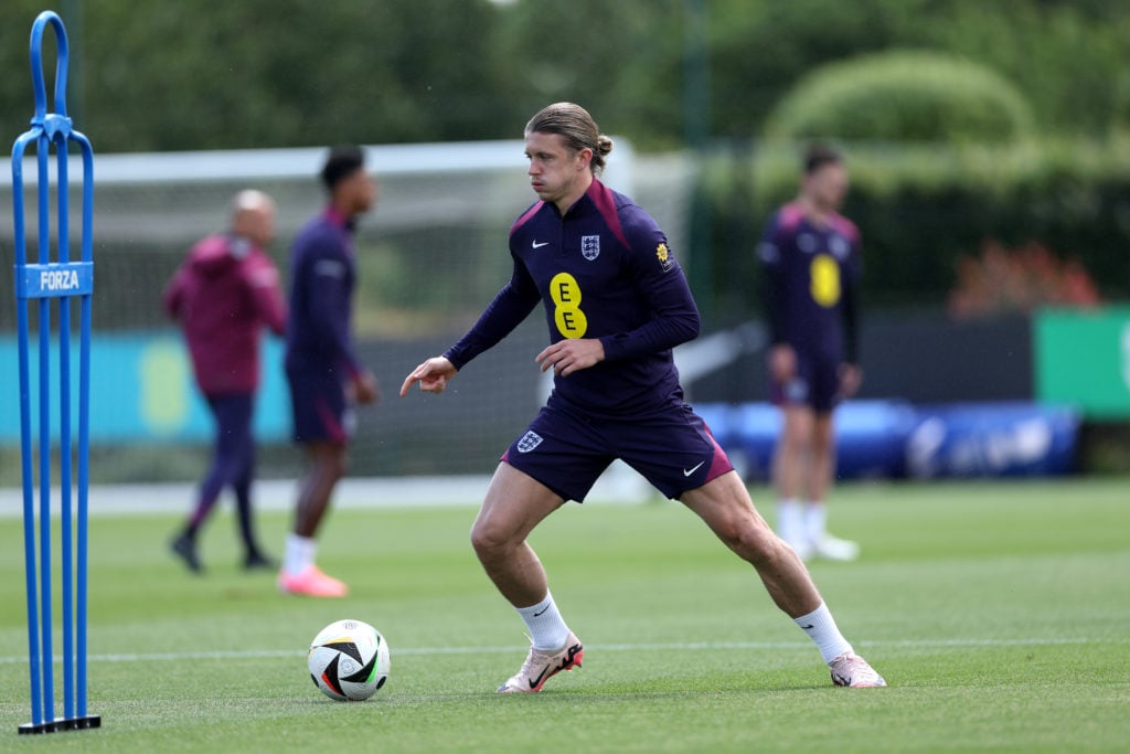 Conor Gallagher of England runs with the ball during a training session at Spurs Lodge on June 05, 2024 in London, England.
