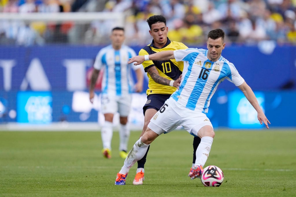 Giovani Lo Celso #16 of Argentina dribbles the ball against Kendry Paez #10 of Ecuador in the first half during an International Friendly match at ...