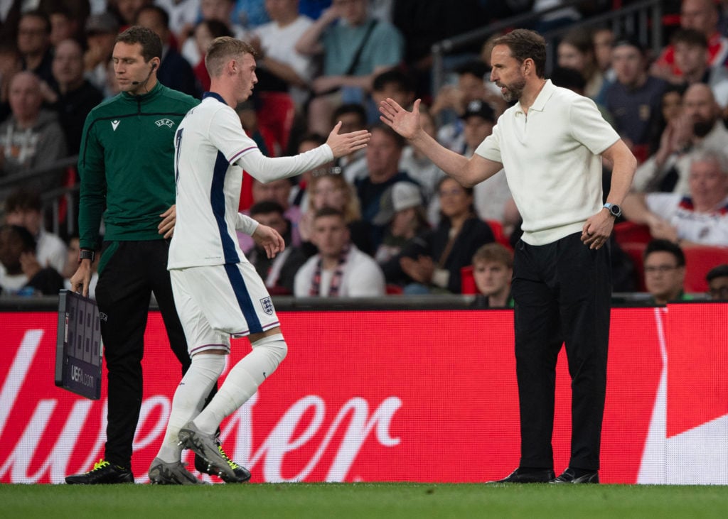 Cole Palmer of England shakes the hand of Gareth Southgate during the international friendly match between England and Iceland at Wembley Stadium o...