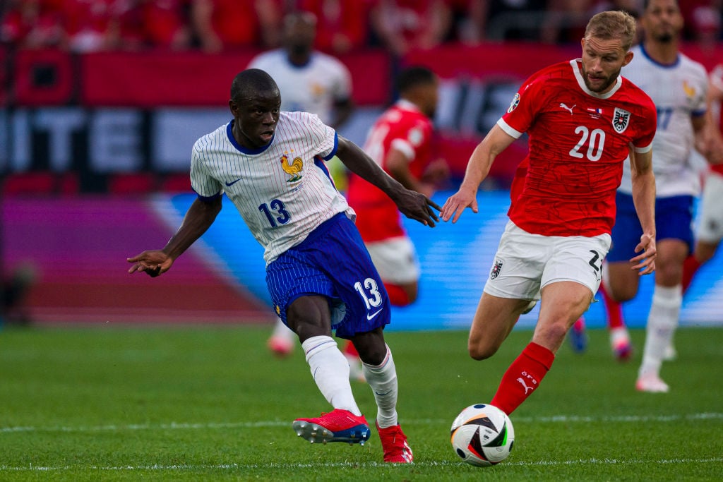 N'Golo Kanté of France (L) is chased by Konrad Laimer of Austria (R) during the UEFA EURO 2024 group stage match between Austria and France at Düss...