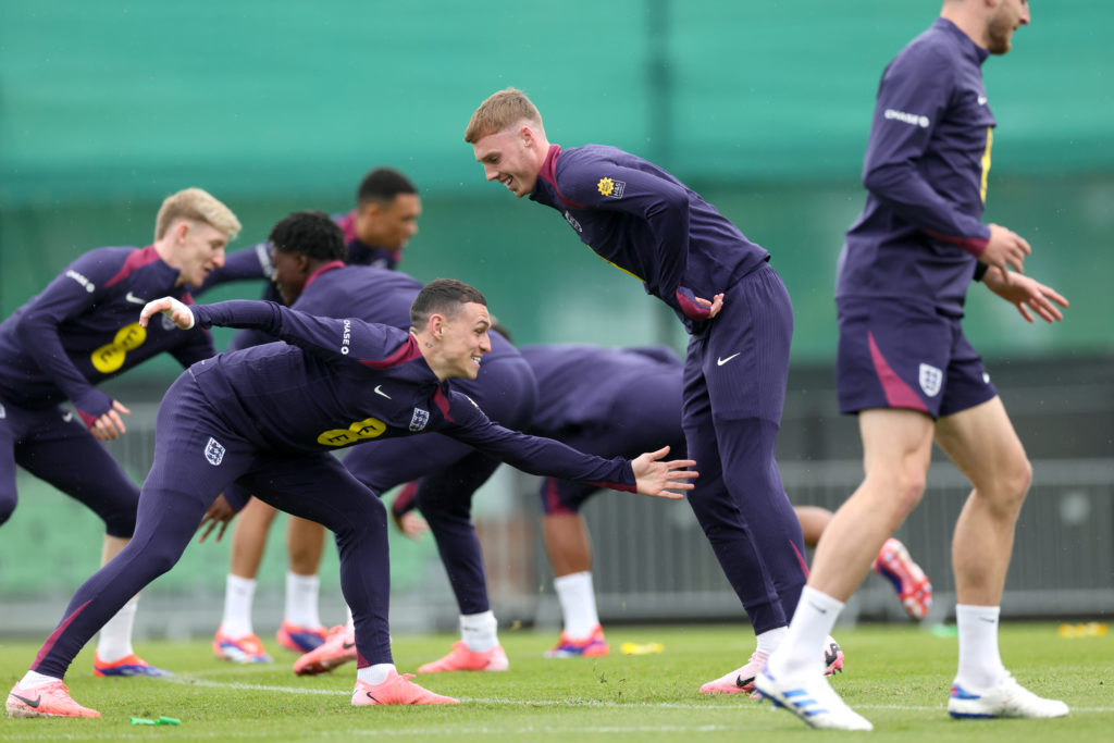Cole Palmer and Phil Foden of England interact during a training session at Spa & Golf Resort Weimarer Land on June 13, 2024 in Blankenhain, Ge...