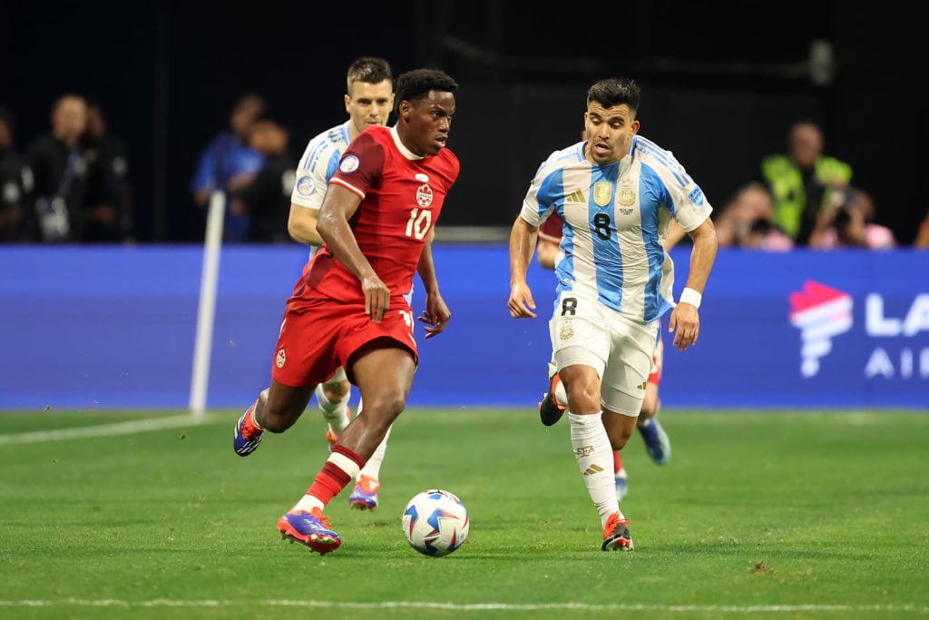 Canada forward Jonathan David (10) is pursued by Argentina defender Marcos Acuna (8)during the CONMEBOL Copa America match between Argentina and Ca...
