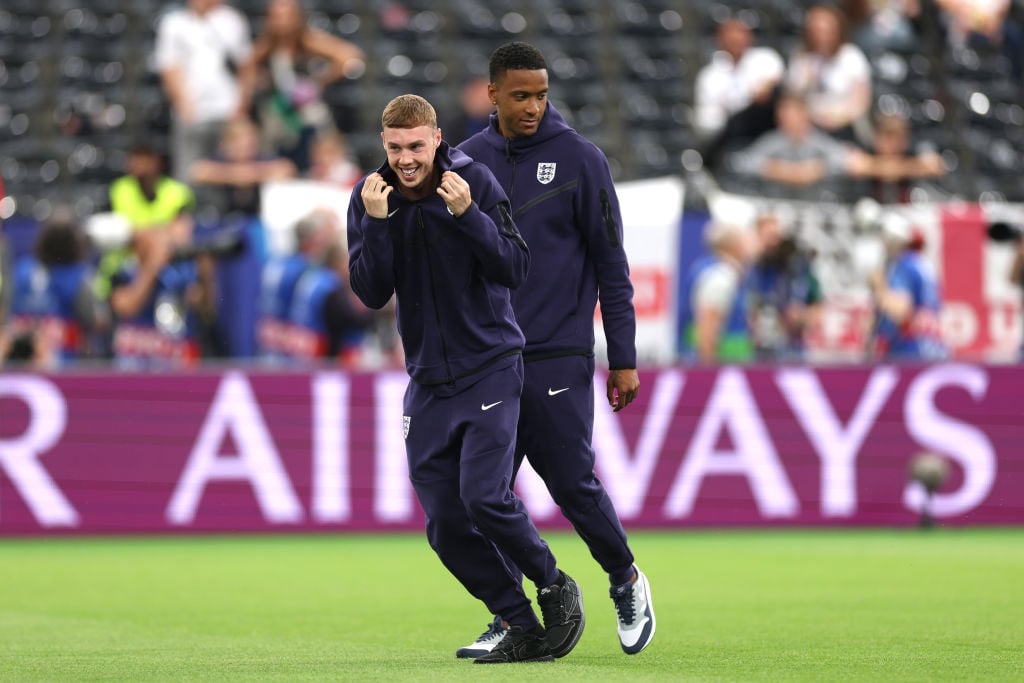 Cole Palmer and Ezri Konsa of England inspect the pitch before the UEFA EURO 2024 group stage match between Denmark and England at Frankfurt Aren...