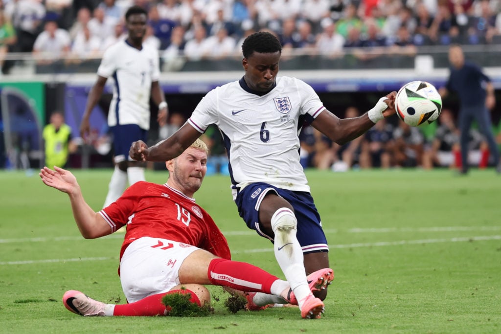 Jonas Wind of Denmark is challenged by Marc Guehi of England  during the UEFA EURO 2024 group stage match between Denmark and England at Frankfurt ...