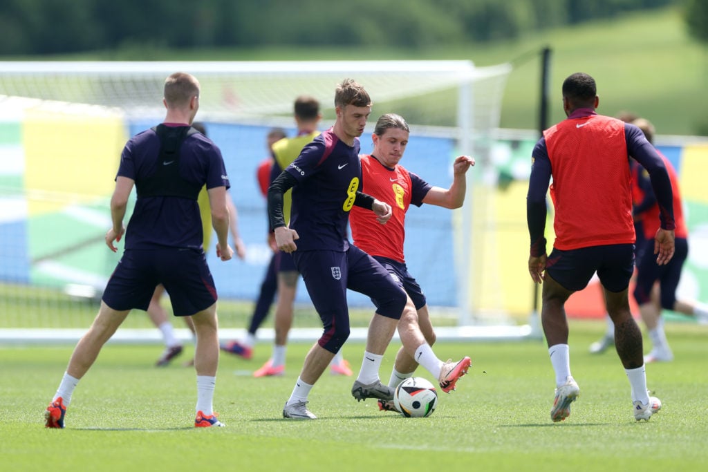 Conor Gallagher and Cole Palmer of England battle for possession during a training session at Spa & Golf Resort Weimarer Land on June 22, 2024 ...