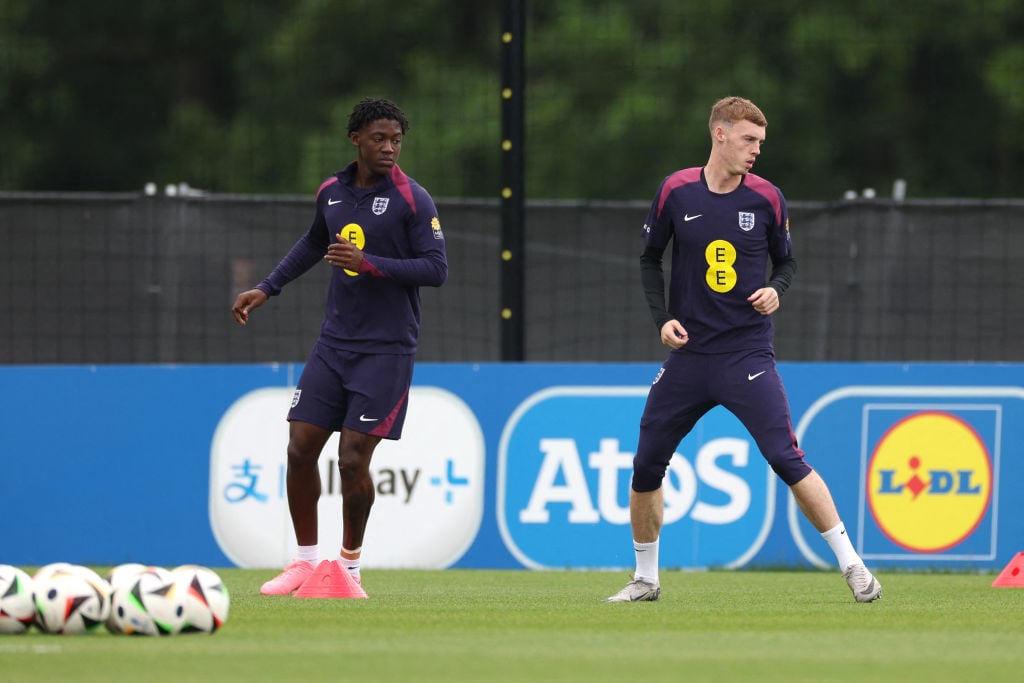 England's midfielder #26 Kobbie Mainoo (L) and England's midfielder #24 Cole Palmer take part in a training session at the team's base camp in Blan...