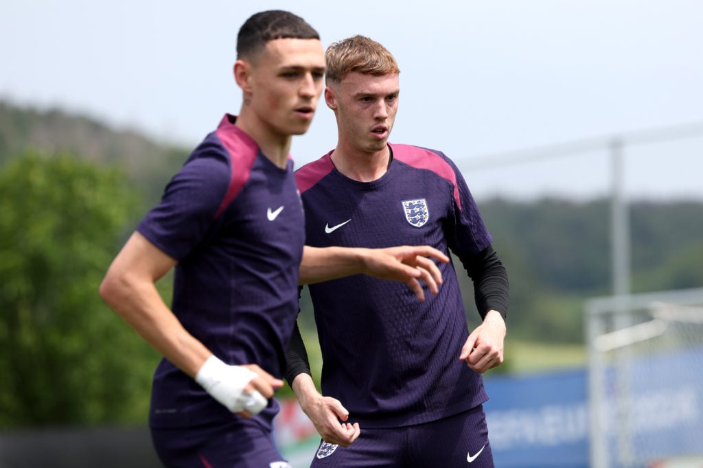 Cole Palmer and Phil Foden of England in action during a training session at Spa & Golf Resort Weimarer Land on June 29, 2024 in Blankenhain, G...