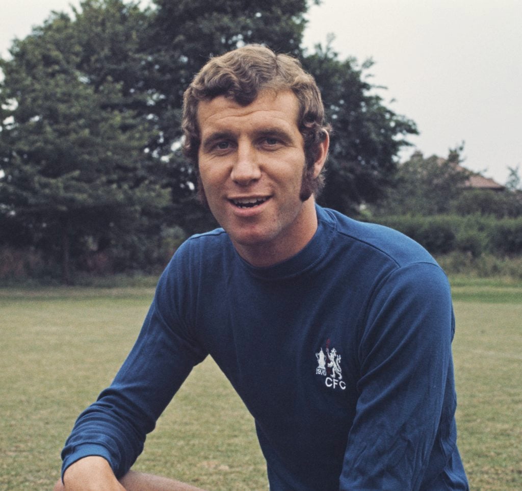 English professional footballer and forward with Chelsea Football Club, Peter Osgood (1947-2006) posed at Chelsea's training ground at the start of...