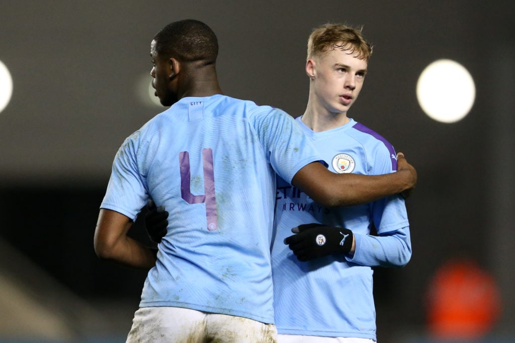Luke Mbete-Tabu and Cole Palmer of Manchester City celebrate their victory during the FA Youth Cup: Fifth Round match between Manchester City and F...