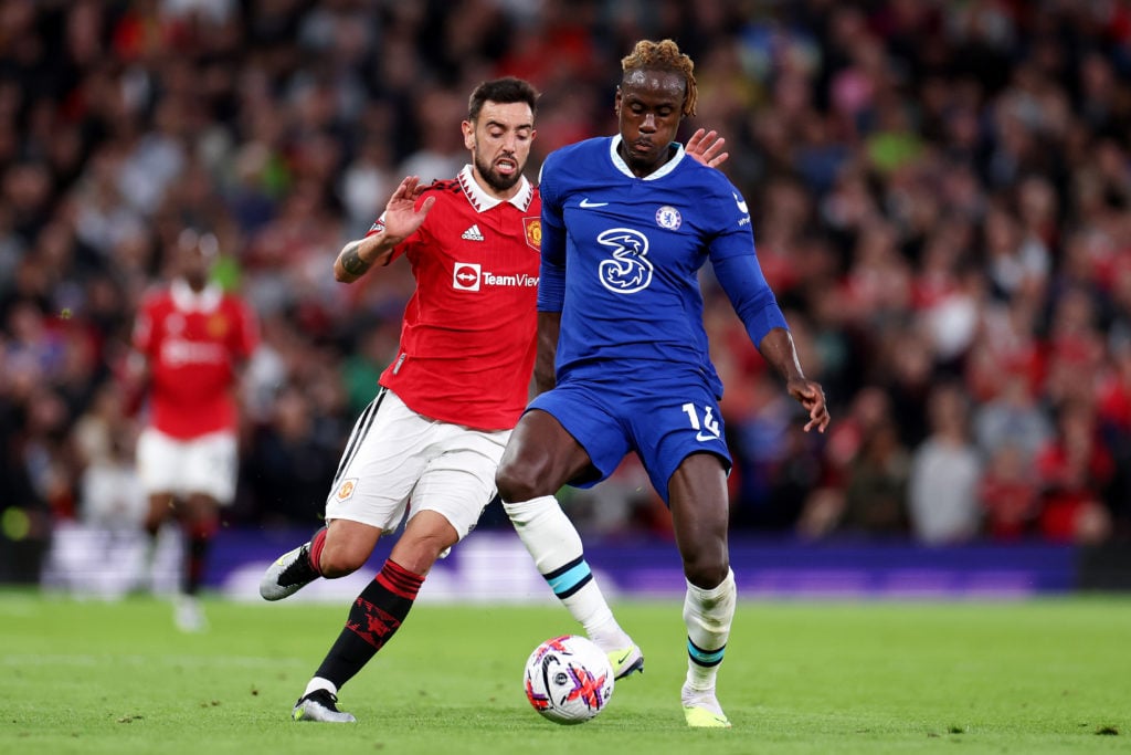 Trevoh Chalobah of Chelsea battles for possession with Bruno Fernandes of Manchester United during the Premier League match between Manchester Unit...