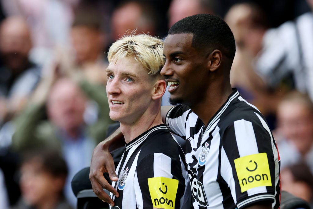 Anthony Gordon of Newcastle United celebrates with team mate Alexander Isak after scoring their sides first goal during the Premier League match be...