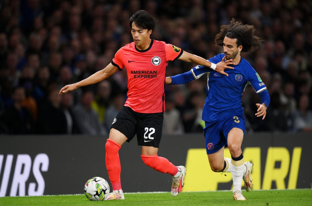 Kaoru Mitoma of Brighton & Hove Albion is challenged by Marc Cucurella of Chelsea  during the Carabao Cup Third Round match between Chelsea and...