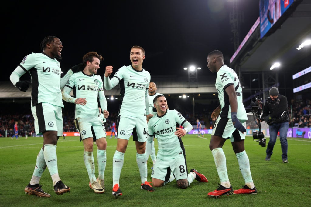 Enzo Fernandez of Chelsea celebrates with team mates after scoring his team's third goal during the Premier League match between Crystal Palace and...