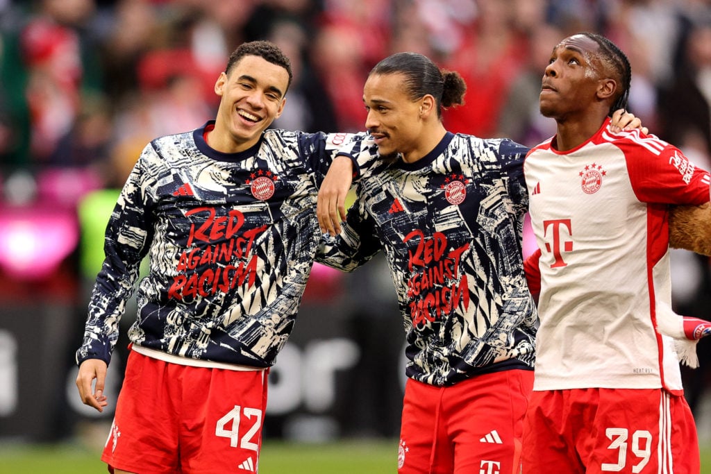 (LR) Jamal Musiala of FC Bayern München and teammates Leroy Sane and Mathys Tel celebrate the victory after the Bundesliga match between FC Bayern ...