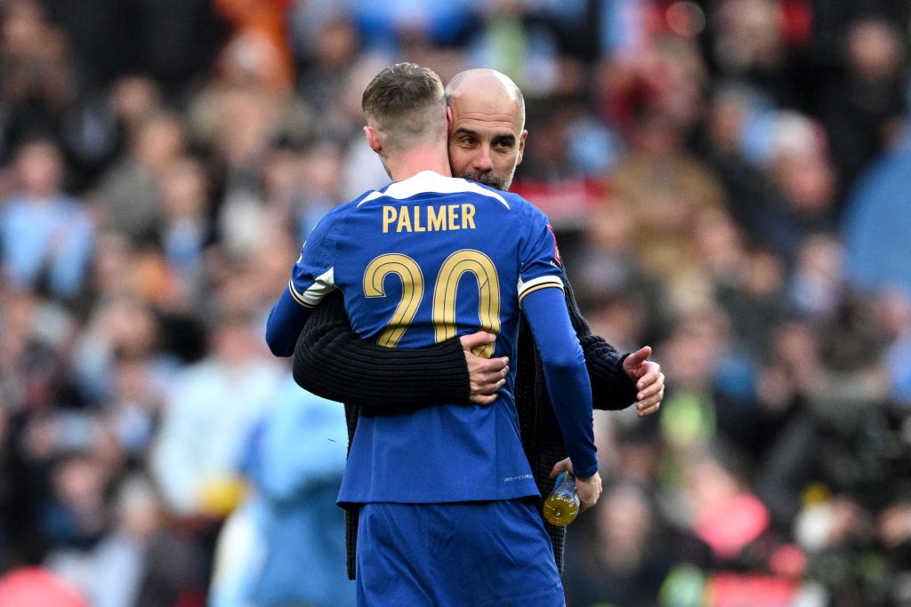 Pep Guardiola, Manager of Manchester City, embraces Cole Palmer of Chelsea after the Emirates FA Cup Semi Final match between Manchester City and C...