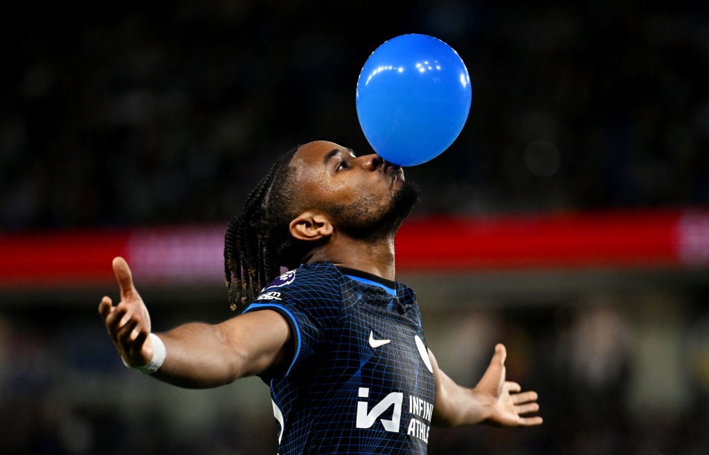 Christopher Nkunku of Chelsea celebrates scoring his team's second goal with a balloon during the Premier League match between Brighton & Hove ...