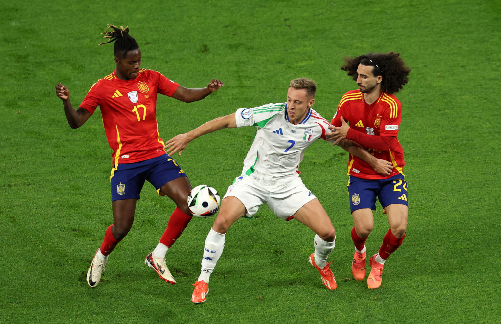 Davide Frattesi of Italy is challenged by Marc Cucurella and Nico Williams of Spain during the UEFA EURO 2024 group stage match between Spain and I...
