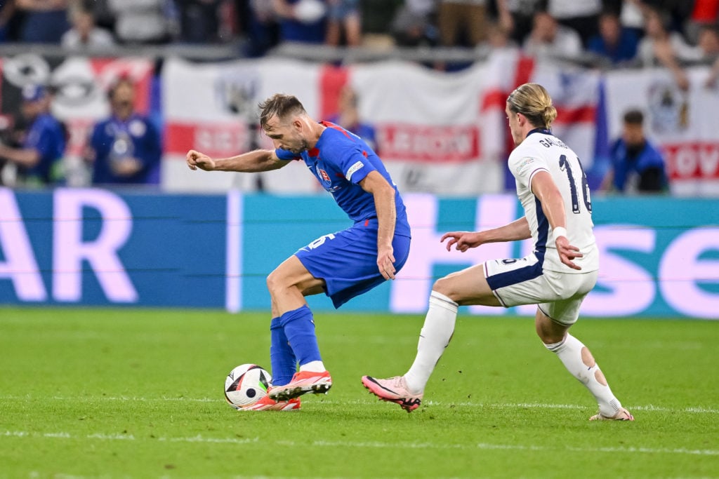 Norbert Gyömbér of Slovakia and Conor Gallagher of England battle for the ball during the UEFA EURO 2024 - Round of 16 match between England and Sl...