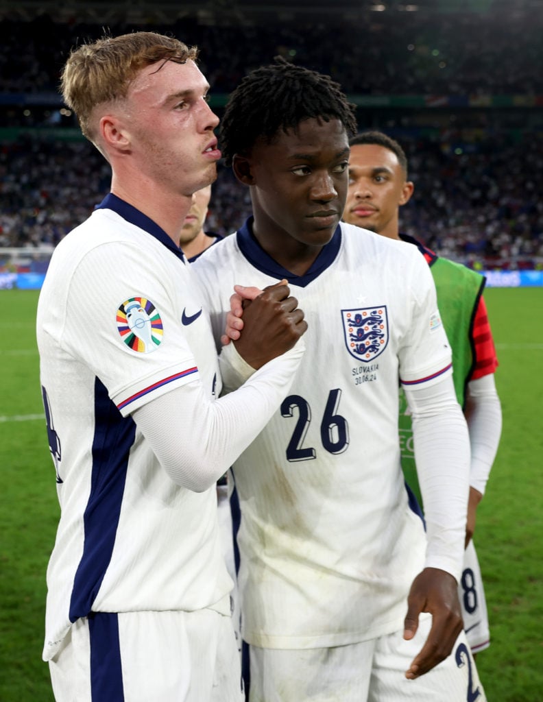 Cole Palmer and Kobbie Mainoo of England celebrate following the UEFA EURO 2024 round of 16 match between England and Slovakia at Arena AufSchalke ...
