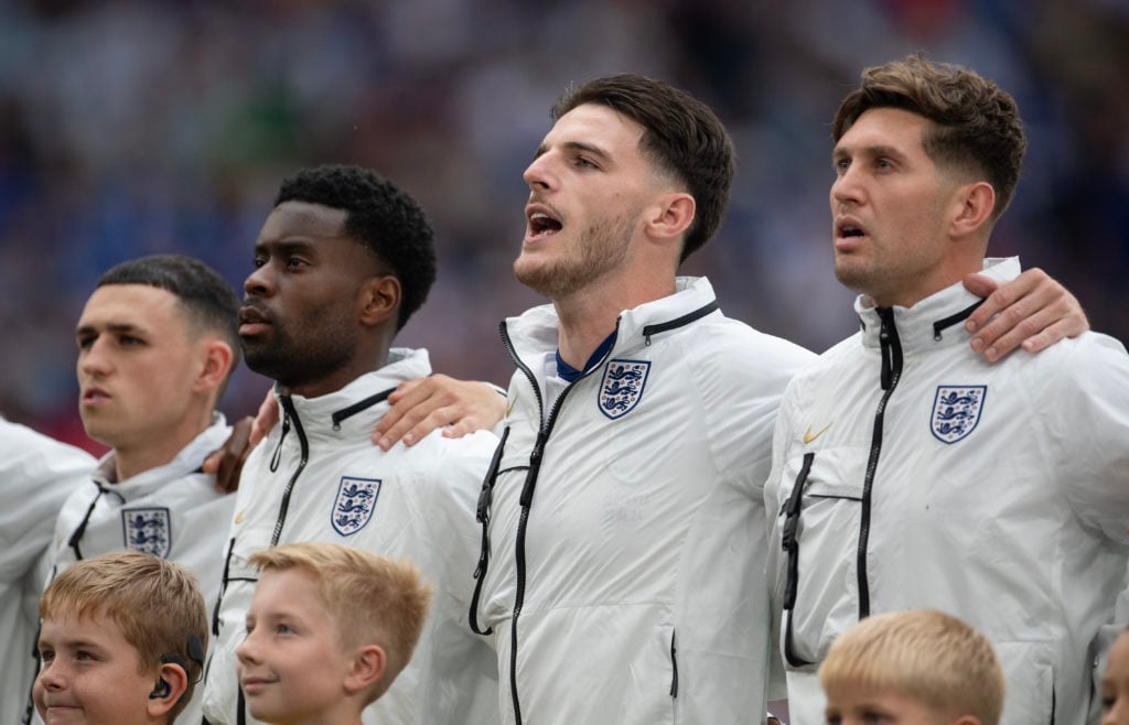 Phil Foden, Marc Guehi, Declan Rice and John Stones of England sing the national anthem prior to the UEFA EURO 2024 round of 16 match between Engla...