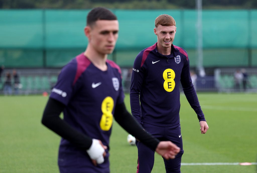 Phil Foden and Cole Palmer of England look on during a training session at Spa & Golf Resort Weimarer Land on July 03, 2024 in Blankenhain, Ger...