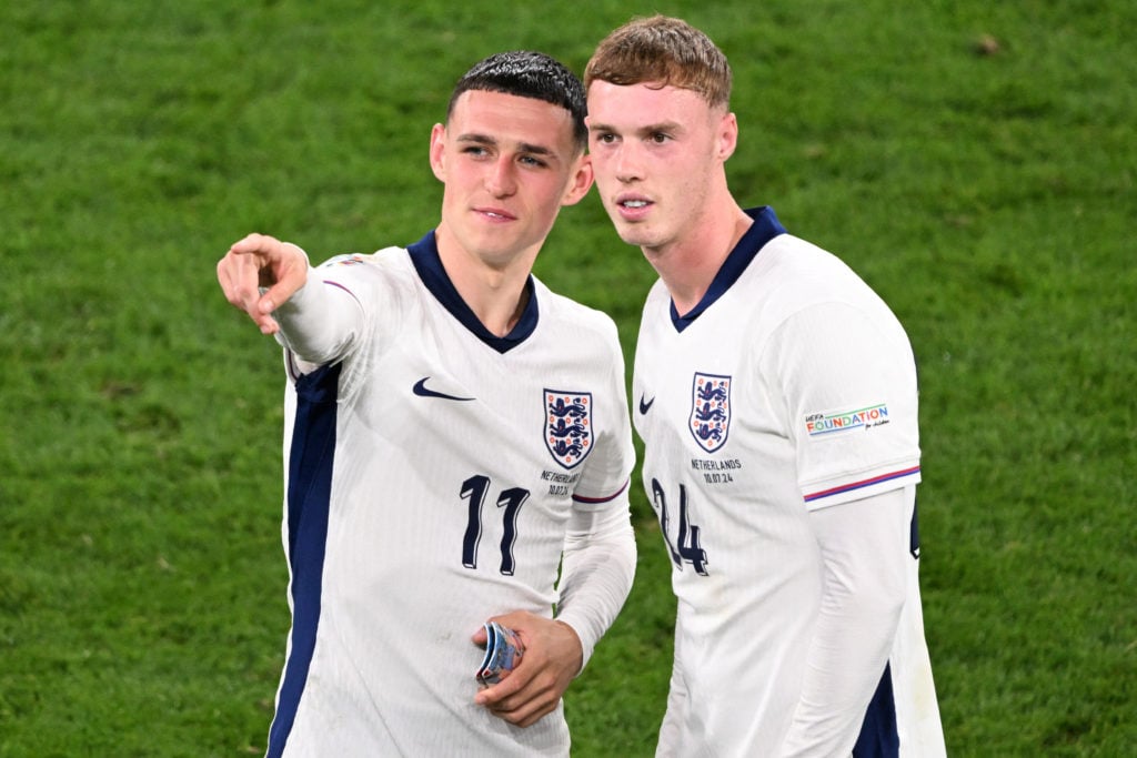 England's midfielder #11 Phil Foden and England's midfielder #24 Cole Palmer celebrate at the end of the UEFA Euro 2024 semi-final football match b...