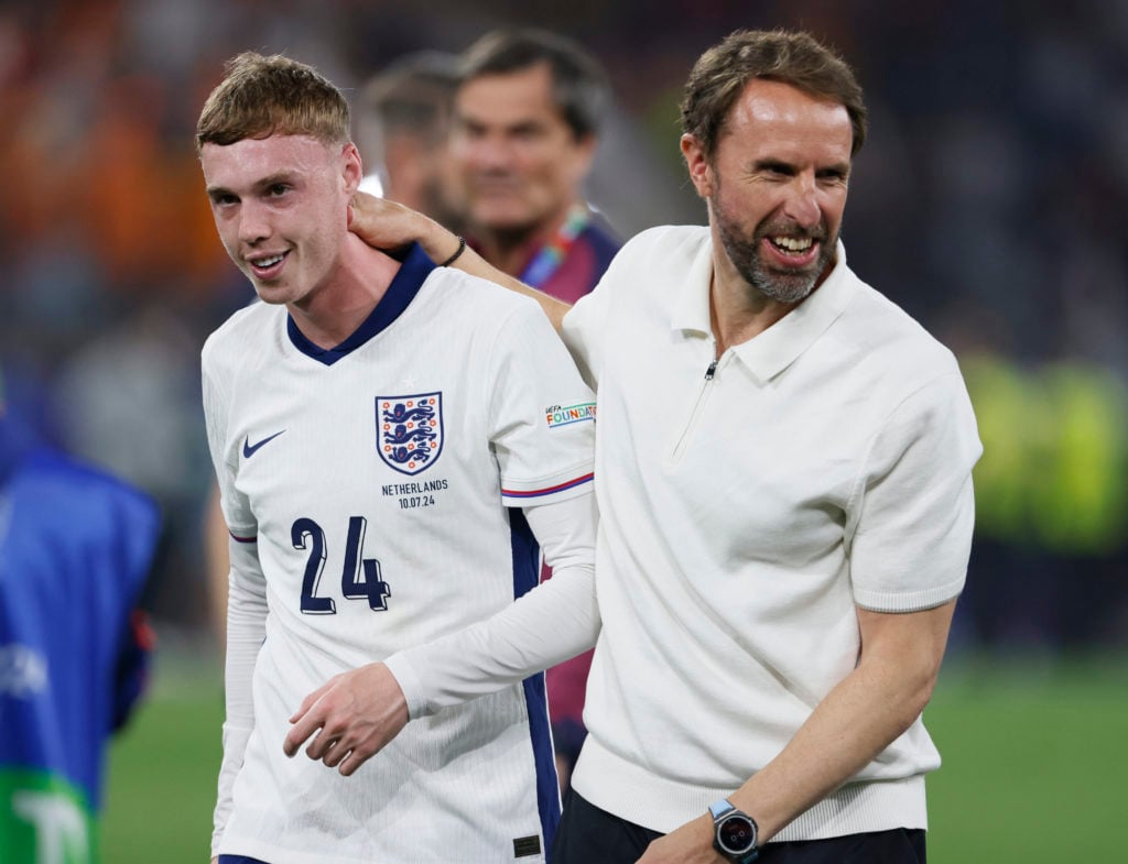 Cole Palmer of England and Gareth Southgate, Manager of England celebrate after winning the UEFA EURO 2024 semi-final match between Netherlands and...