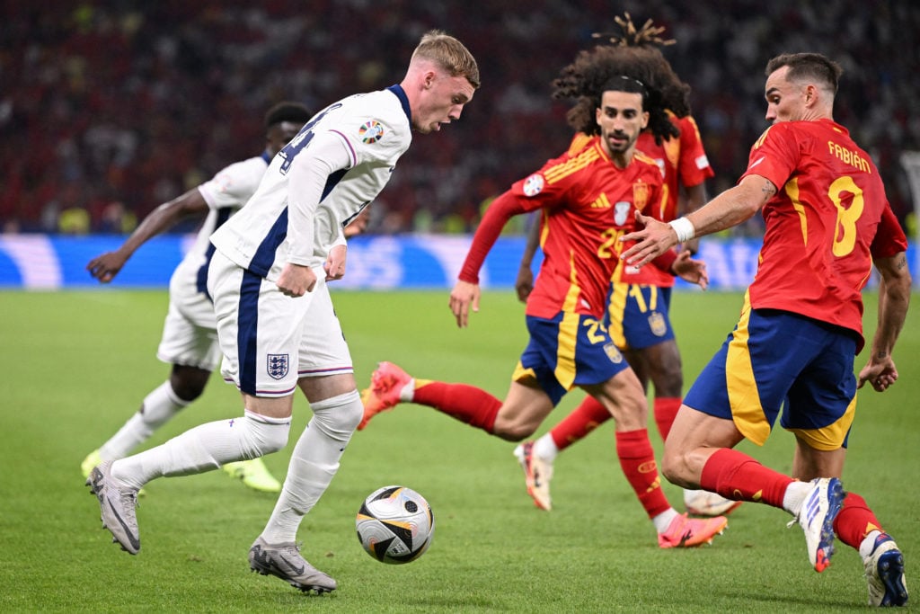 (From L) England's midfielder #24 Cole Palmer, Spain's defender #24 Marc Cucurella and Spain's midfielder #08 Fabian Ruiz fight for the ball during...