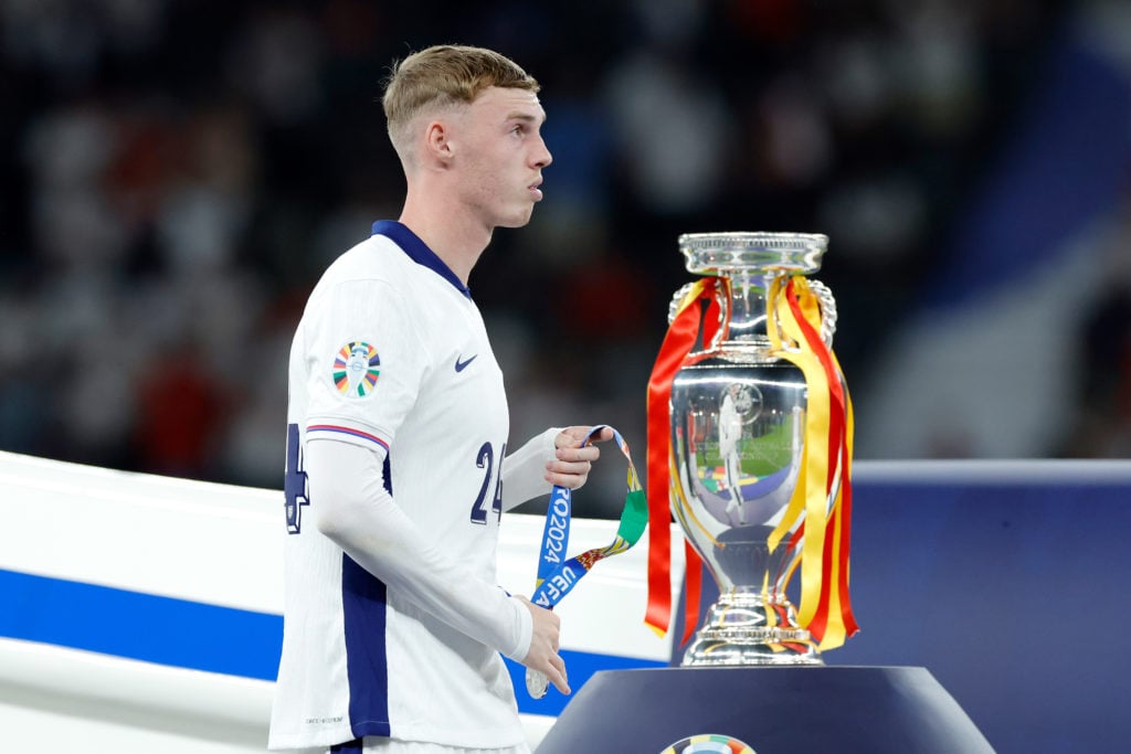 Cole Palmer of England passing dejected the European Championship Trophy during the  EURO match between Spain  v England  at the Olympiastadium on ...