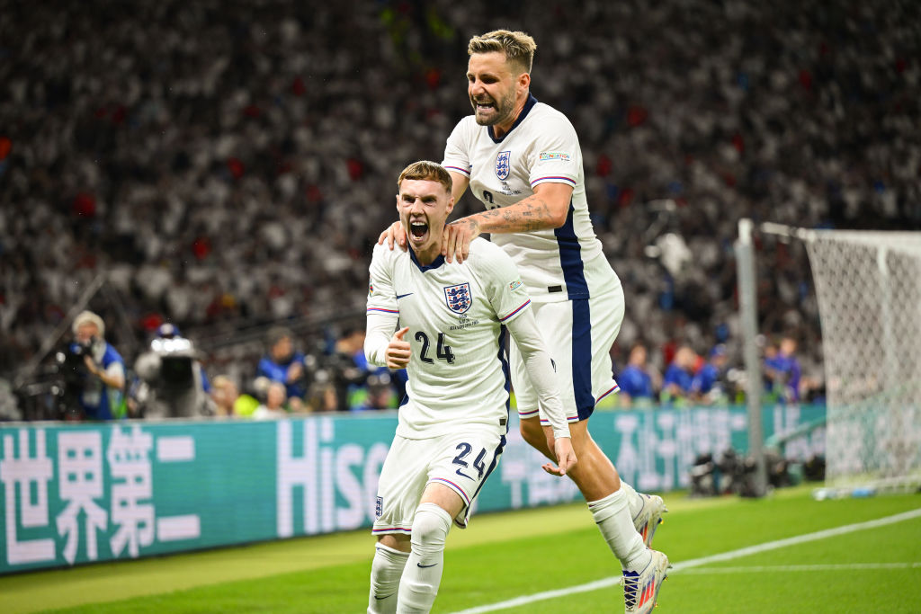 Cole Palmer of England celebrates scoring to make it 1-1 with team mate Luke Shaw during the UEFA EURO 2024 final match between Spain and England a...