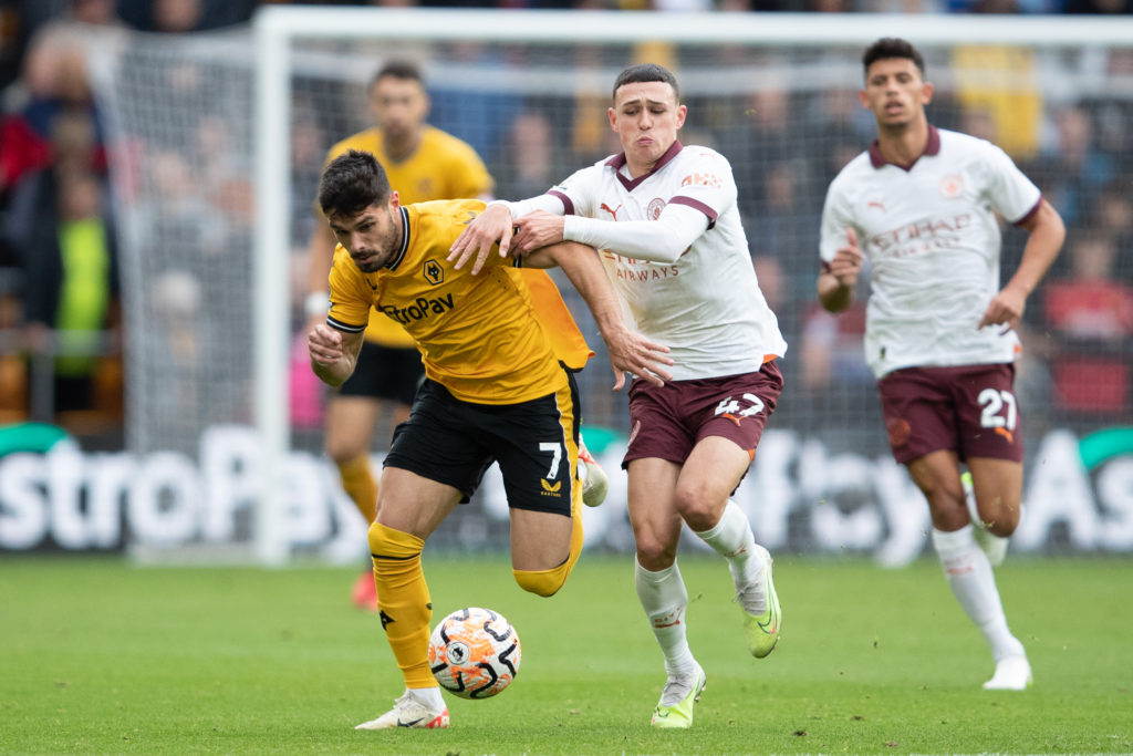 Pedro Neto of Wolves (L) and Phil Foden of Manchester City during the Premier League match between Wolverhampton Wanderers and Manchester City at M...