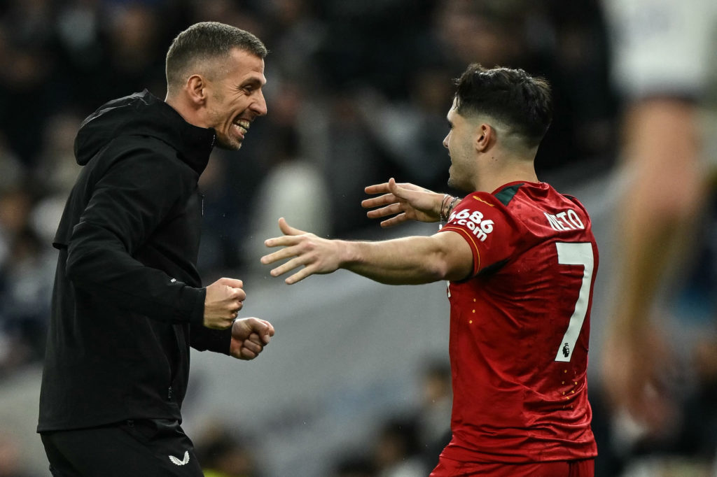 Wolverhampton Wanderers' English head coach Gary O'Neil (L) celebrates with Wolverhampton Wanderers' Portuguese midfielder #07 Pedro Neto at the en...