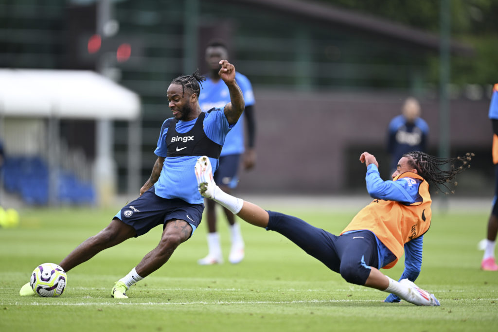 Raheem Sterling and Malo Gusto of Chelsea during a training session at Chelsea Training Ground on July 10, 2024 in Cobham, England.
