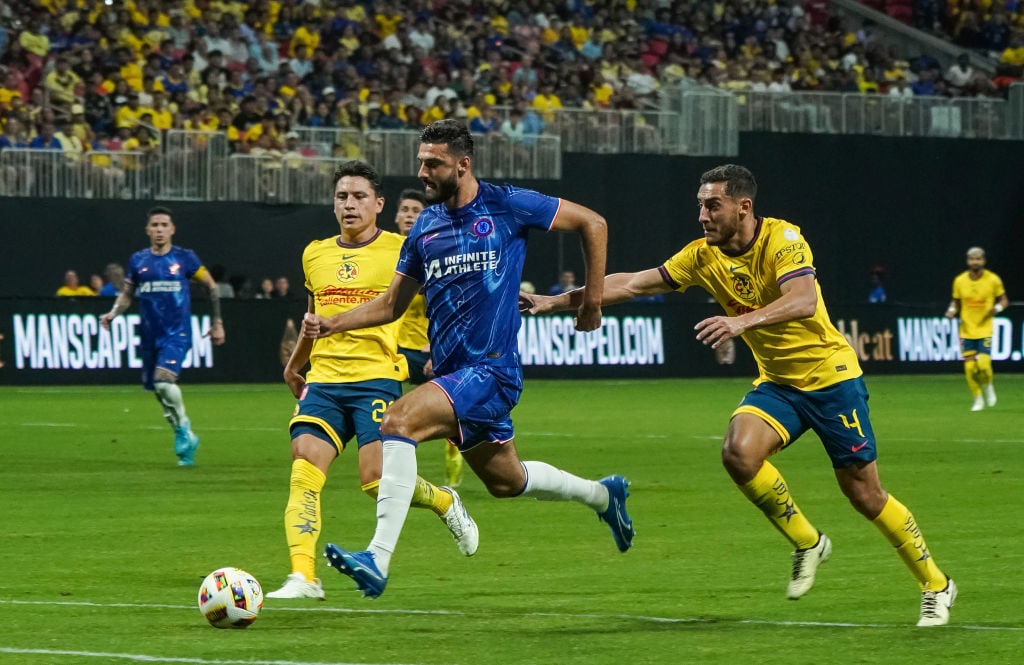 Chelsea's Albanian striker #19 Armando Broja and Club America's #04 Sebastian Caceres vie for the ball during during an FC Series pre-season club f...