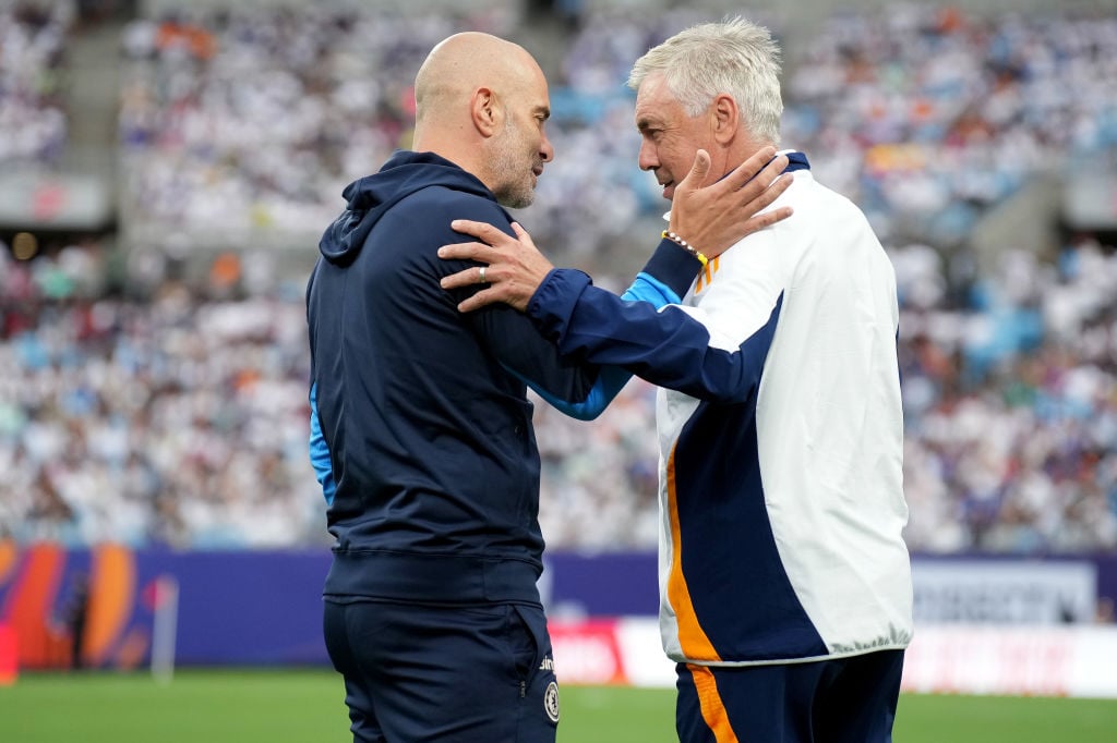 Head coach Enzo Maresca of Chelsea talks with head coach Carlo Ancelotti of Real Madrid during a pre-season friendly match at Bank of America Stadi...