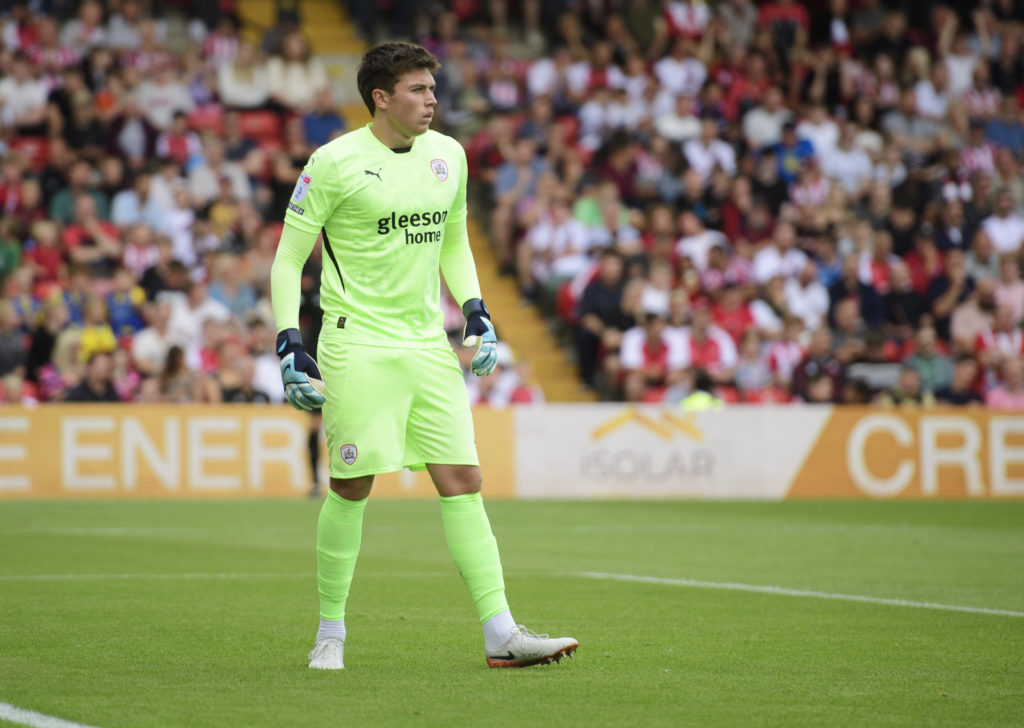 Gabriel Slonina of Barnsley during the Sky Bet League One match between Lincoln City FC and Barnsley FC at LNER Stadium on August 17, 2024 in Linco...