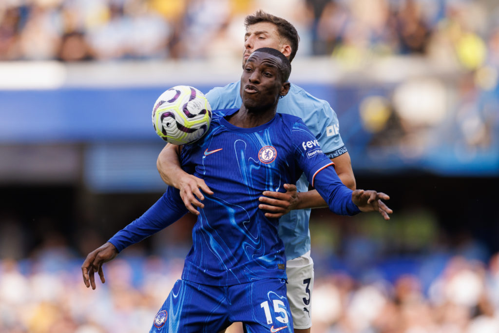 Nicolas Jackson of Chelsea in action with Ruben Dias of Manchester City during the Premier League match between Chelsea FC and Manchester City FC ...