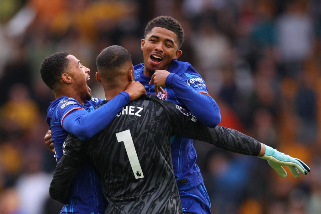 Levi Colwill and Wesley Fofana celebrate with Robert Sanchez.