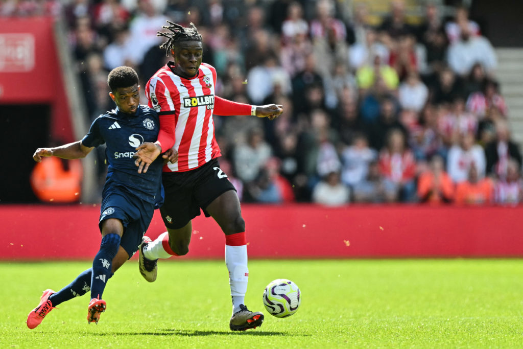 Manchester United's Ivorian midfielder #16 Amad Diallo (L) fights for the ball with Southampton's French midfielder #26 Lesley Ugochukwu during the...