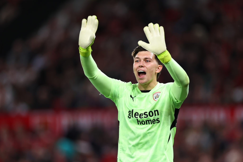 Gabriel Slonina of Barnsley during the Carabao Cup Third Round match between Manchester United and Barnsley at Old Trafford on September 17, 2024 i...
