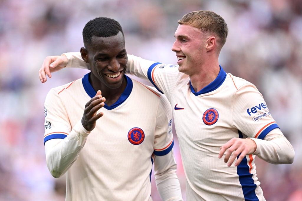 Cole Palmer of Chelsea celebrates scoring his team's third goal with Nicolas Jackson of Chelsea during the Premier League match between West Ham Un...