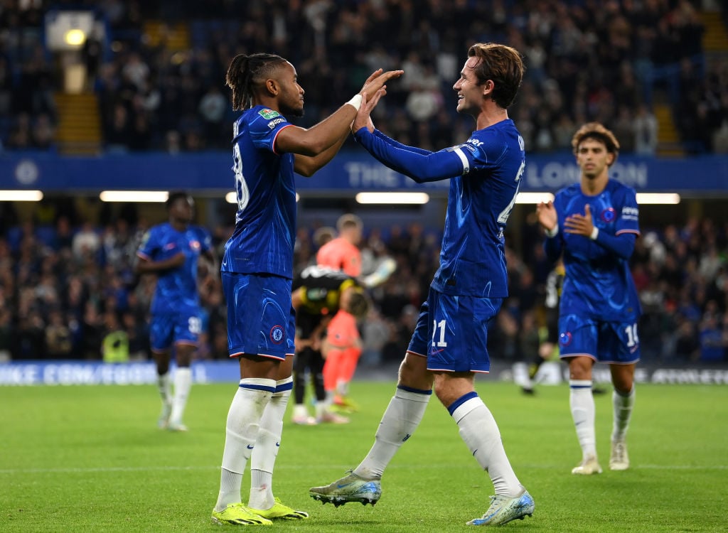 Christopher Nkunku of Chelsea celebrates scoring his team's fifth goal, and completing his hattrick with teammate Ben Chilwell during the Carabao C...