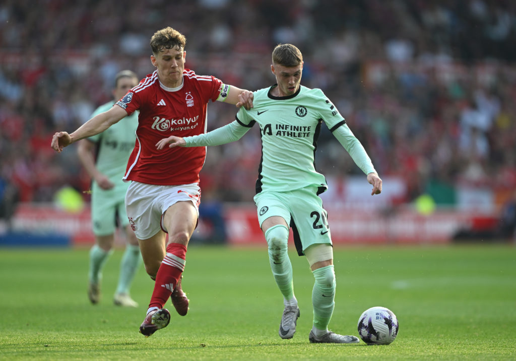 Cole Palmer of Chelsea is challenged by Ryan Yates of Nottingham Forest during the Premier League match between Nottingham Forest and Chelsea FC at...